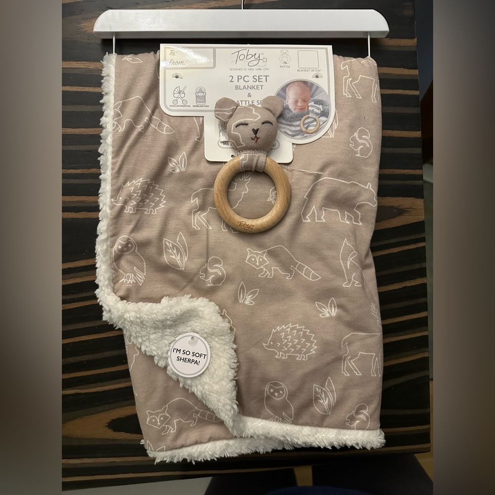 Toby’s NYC animal printed Sherpa blanket with rattle